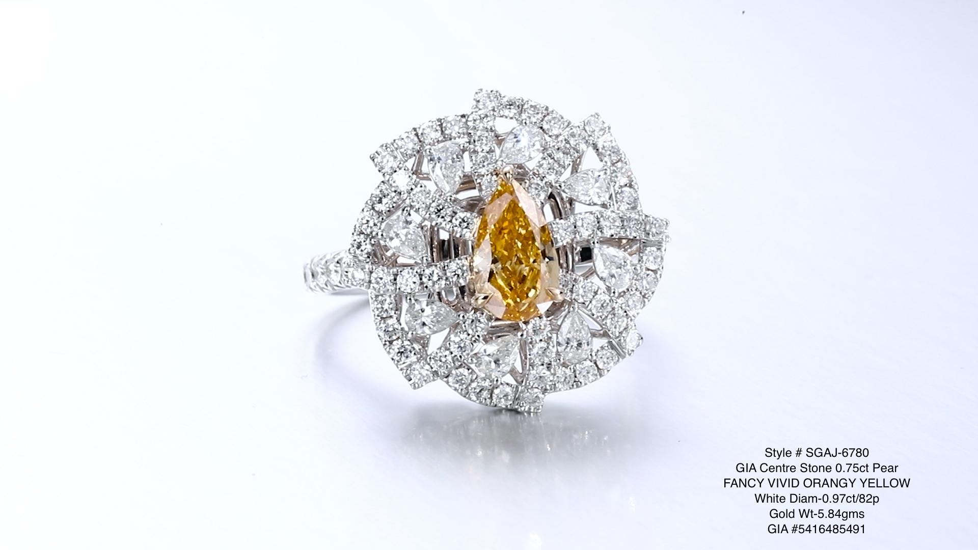A breathtaking jewellery piece featuring a mesmerising 0.75ct pear-shaped natural fancy vivid orange-yellow diamond as its centrepiece. This extraordinary diamond is elegantly set in 18kt gold, creating a luxurious and captivating design.

The star