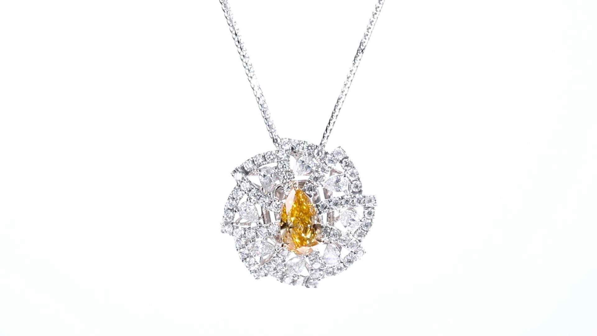 Pear Cut GIA Certified. 0.75ct Pear Shaped Natural Fancy Vivid Orangy Yellow Diamond Ring For Sale