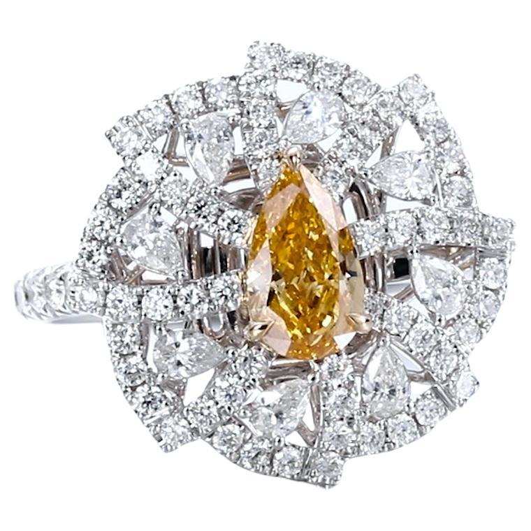 GIA Certified. 0.75ct Pear Shaped Natural Fancy Vivid Orangy Yellow Diamond Ring For Sale