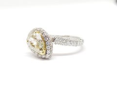 GIA Certified 0.76 Carat Fancy green, Yellow Pear Shape Ring in 18K White Gold