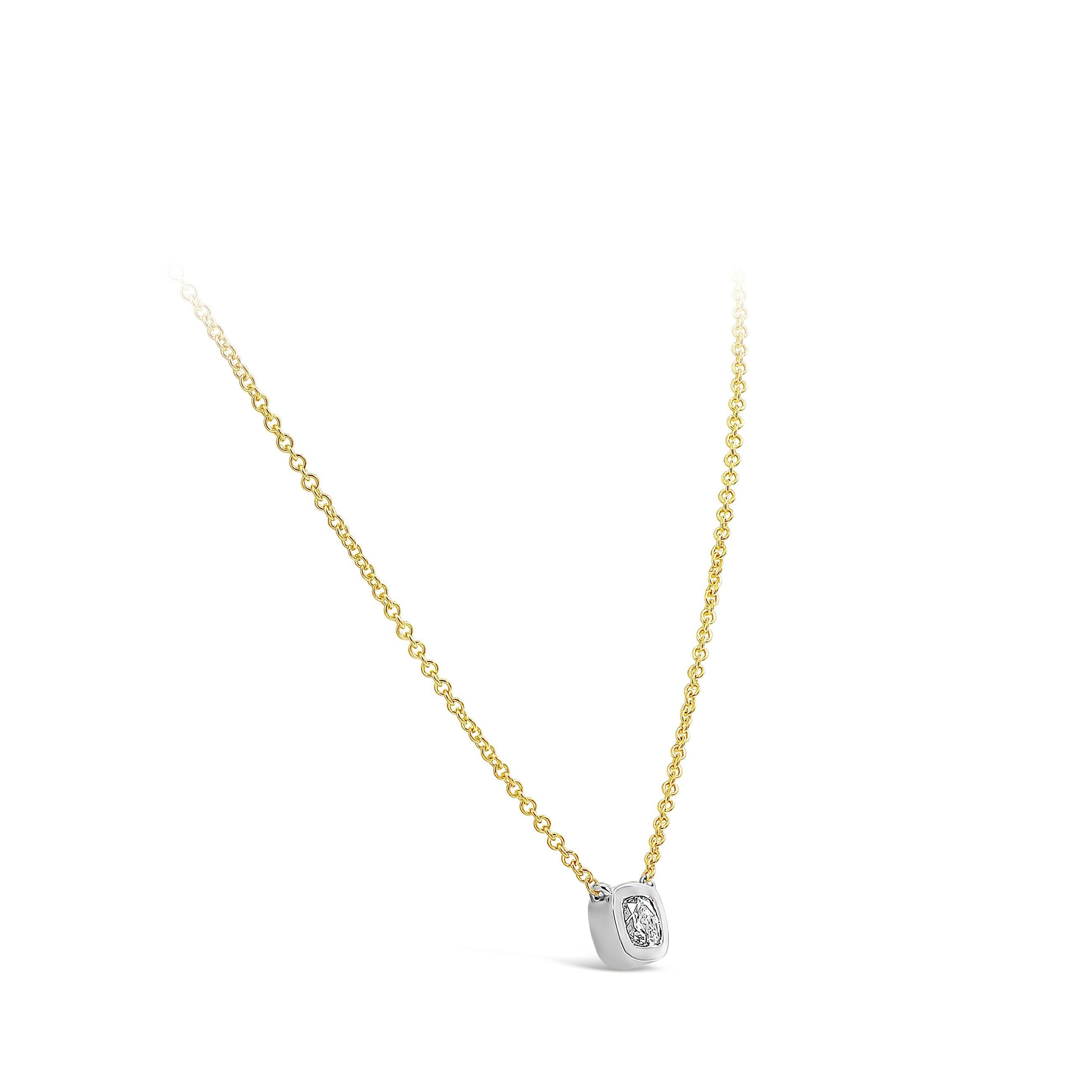 A simple pendant necklace showcasing a GIA Certified 0.77 carat cushion cut diamond, E Color and SI2 in Clarity. Bezel set in a 14K White Gold, suspended on a 14K Yellow Gold chain. 16 inches in Length. 

Roman Malakov is a custom house,