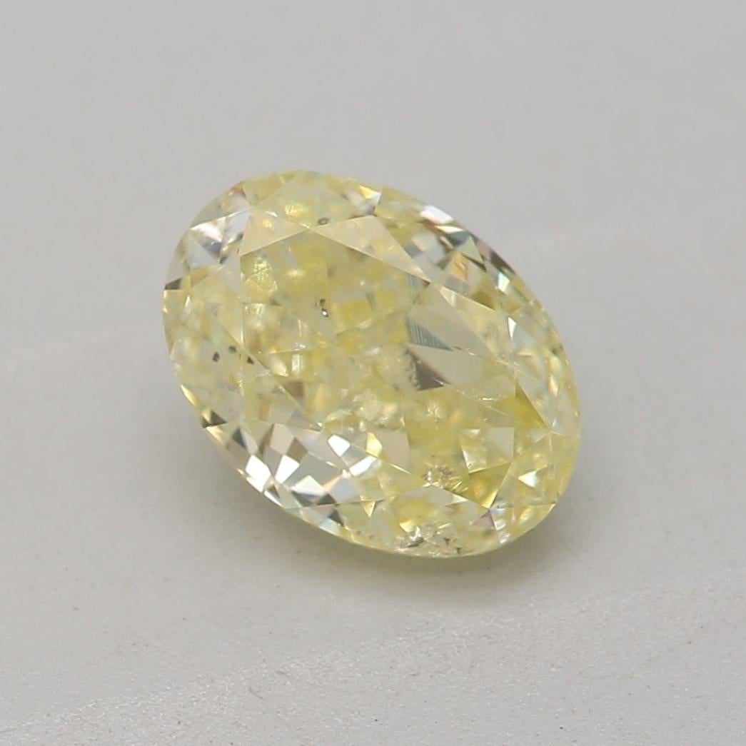 Oval Cut GIA Certified 0.78 Carat Fancy Yellow I1 Clarity Diamond For Sale