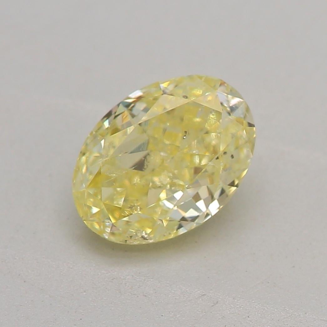 Certificate: GIA
Report Number: 1226385862
Shape And Cut: Oval
Carat Weight: 0.78 carat
Measurements: 6.54 x 4.77 x 3.25 mm
Color Grade: Fancy Yellow

A fancy yellow diamond is a naturally occurring diamond that possesses a vivid yellow color that
