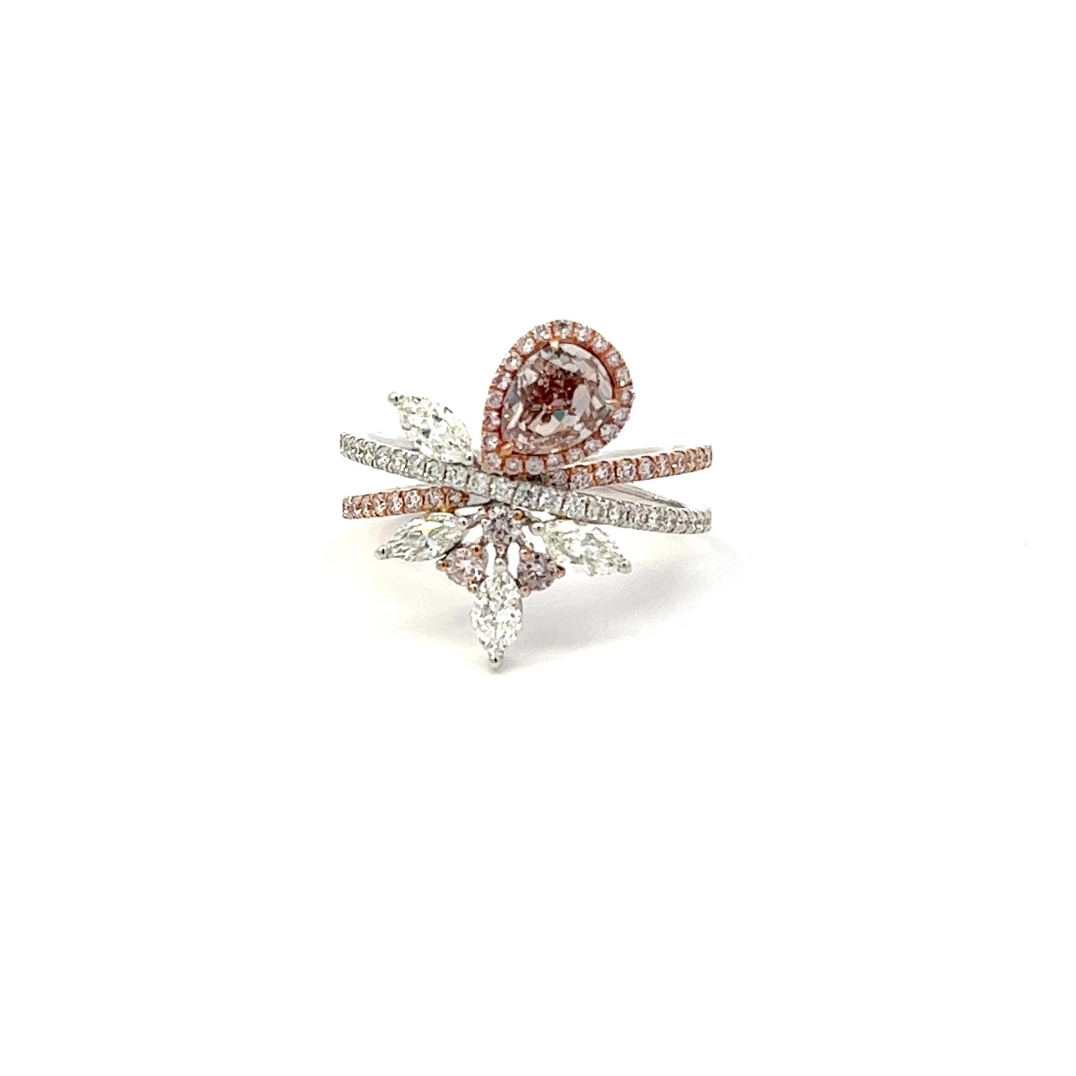 Center: 0.79ct Fancy Pinkish Brown Pear VS1 GIA# 2185805123
Setting: 18k White Gold 1.05ctw Pink and White Diamonds

An extremely rare and stunning natural pink diamond center. Pink Diamonds account for less than 0.01% of all diamonds mined in the