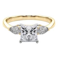 Anello con diamante a tre pietre Princess East-West certificato GIA da 0.8 carati