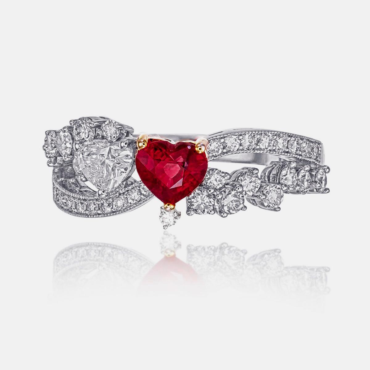 A brand new ring by REWA Jewelry which reimagines the timeless Toi et Moi style with a captivating pairing of a heart-shaped diamond and a rich ruby.

The centre of the ring is a heart shaped GIA (Gemological Institute of America) certified natural