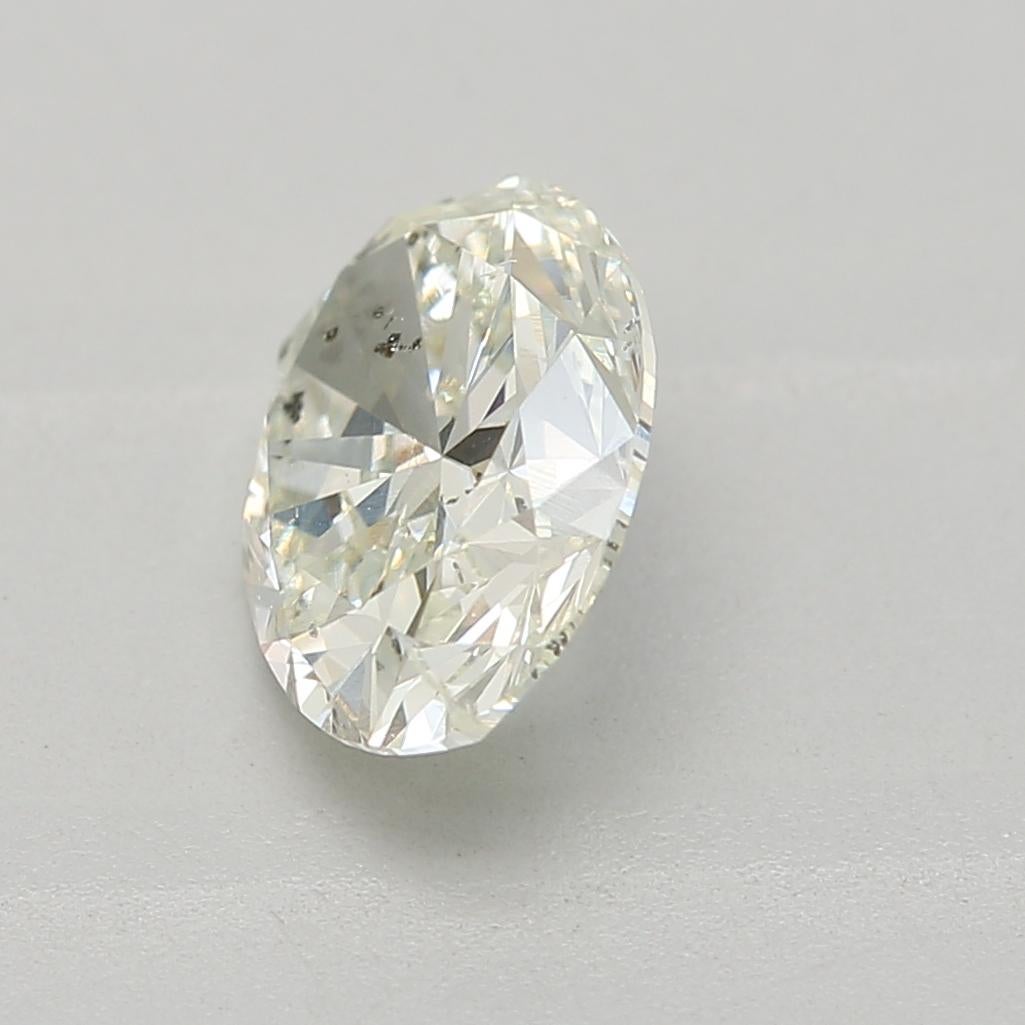 Oval Cut GIA Certified 0.81 Carat Very Light Yellow Green SI2 Clarity Diamond For Sale