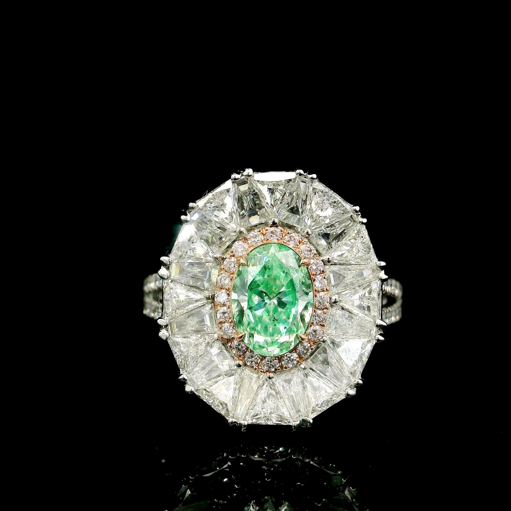 18kt white gold ring with diamonds
  
  Gold colour & karat: White gold 18kt
  Weight: 5.545 grams
  
  Set with-
  Stone type: Diamonds
  Shape: Oval
  Carat: 0.81 ct
  Colour: Very Light Yellow Green
  Clarity: SI2
  
  Surrounding Stones:
