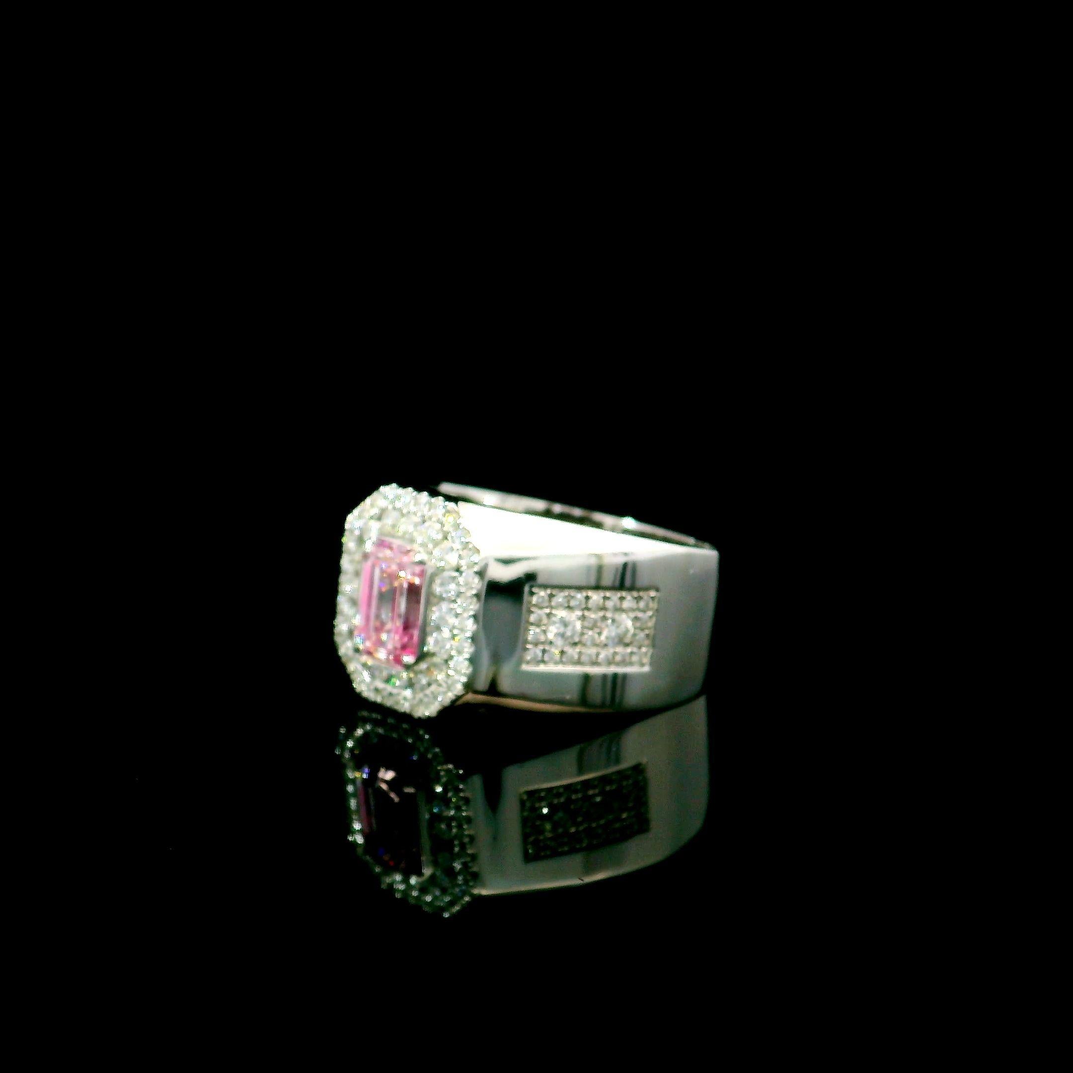 18kt white gold ring with diamonds
  
  Gold colour & karat: White gold 18kt
  Weight: 7.99 grams
  
  Set with-
  Stone type: Diamonds
  Shape: Emerald
  Carat: 0.82
  Colour: Faint Pink  
  Clarity: SI1
  
  Surrounding Stones: Diamonds
 1) White