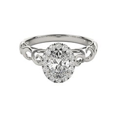 Anillo de diamantes catedral ovalado halo de 0.82 quilates certificado por el GIA