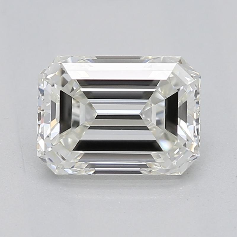 Handcrafted in New York, this exquisite diamond ring showcases a remarkable emerald J VS1 0.83 center stone that captivates with its brilliance and fire. The design is inspired by vintage Art Deco aesthetics, elegantly featuring a prong-set center