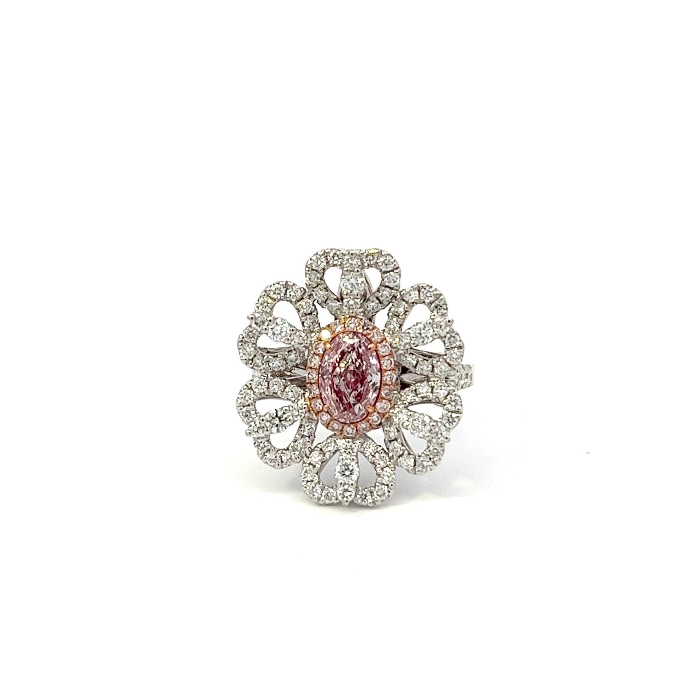 Center: 0.84ct Fancy Light Pinkish Brown SI1 GIA# 5373091338
Setting: 18k White Gold 1.08ctw Pink and White Diamonds

An extremely rare and stunning natural pink diamond center. Pink Diamonds account for less than 0.01% of all diamonds mined in the