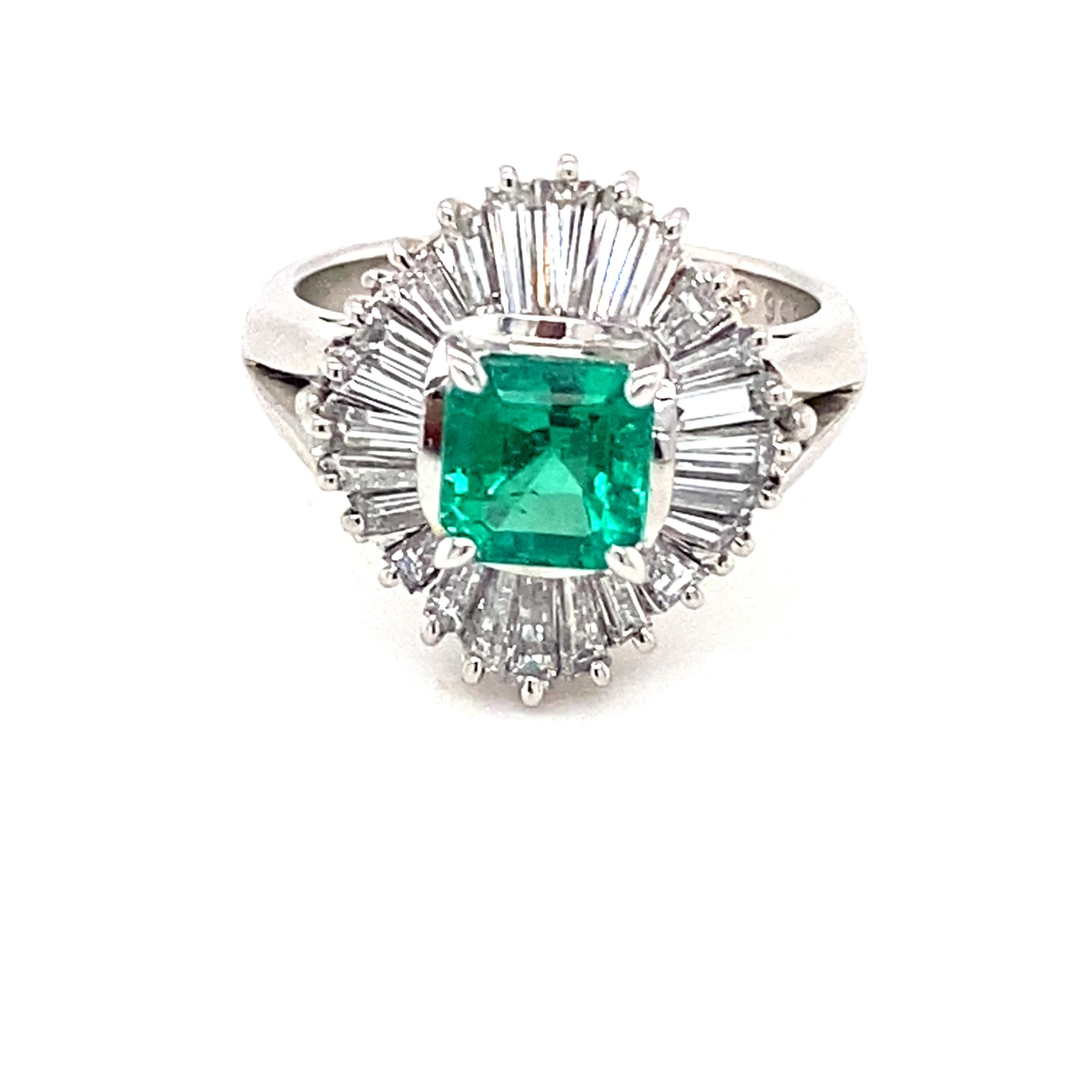 This stunning ring features a GIA-certified Colombian emerald, octagon cut, weighing 0.85 carats, complemented by 0.95 carats of baguette diamonds. Set in beautifully crafted platinum, the diamonds boast a clarity of VS1-VS2 and a color grade of