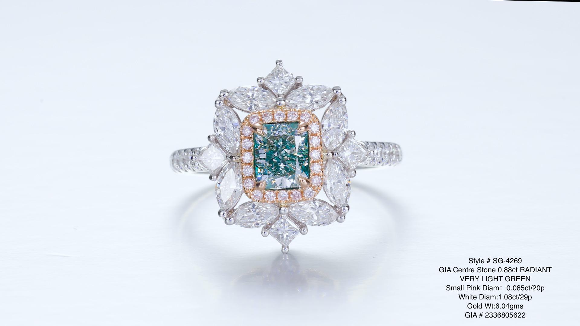 0.88ct very light green radiant mounted on 18KT gold with white and pink diamonds on the side.

The enchanting beauty of this 0.88ct fancy very light green diamond ring, delicately mounted on 18KT gold. The rare and captivating green diamond steals