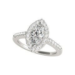 Anello con diamanti aureolati e brillanti rotondi certificati GIA da 0,8 ct.