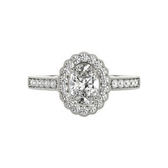 Bague en or blanc 18 carats diamant certifié GIA 0,9 carat ovale halo ajouré pavé
