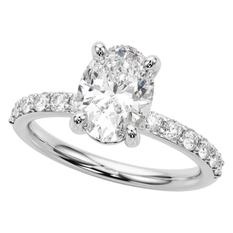 Anello con diamante solitario ovale e canale con punte di 0.9 carati certificato GIA