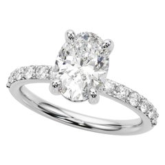 Anello con diamante solitario ovale e canale con punte di 0.9 carati certificato GIA