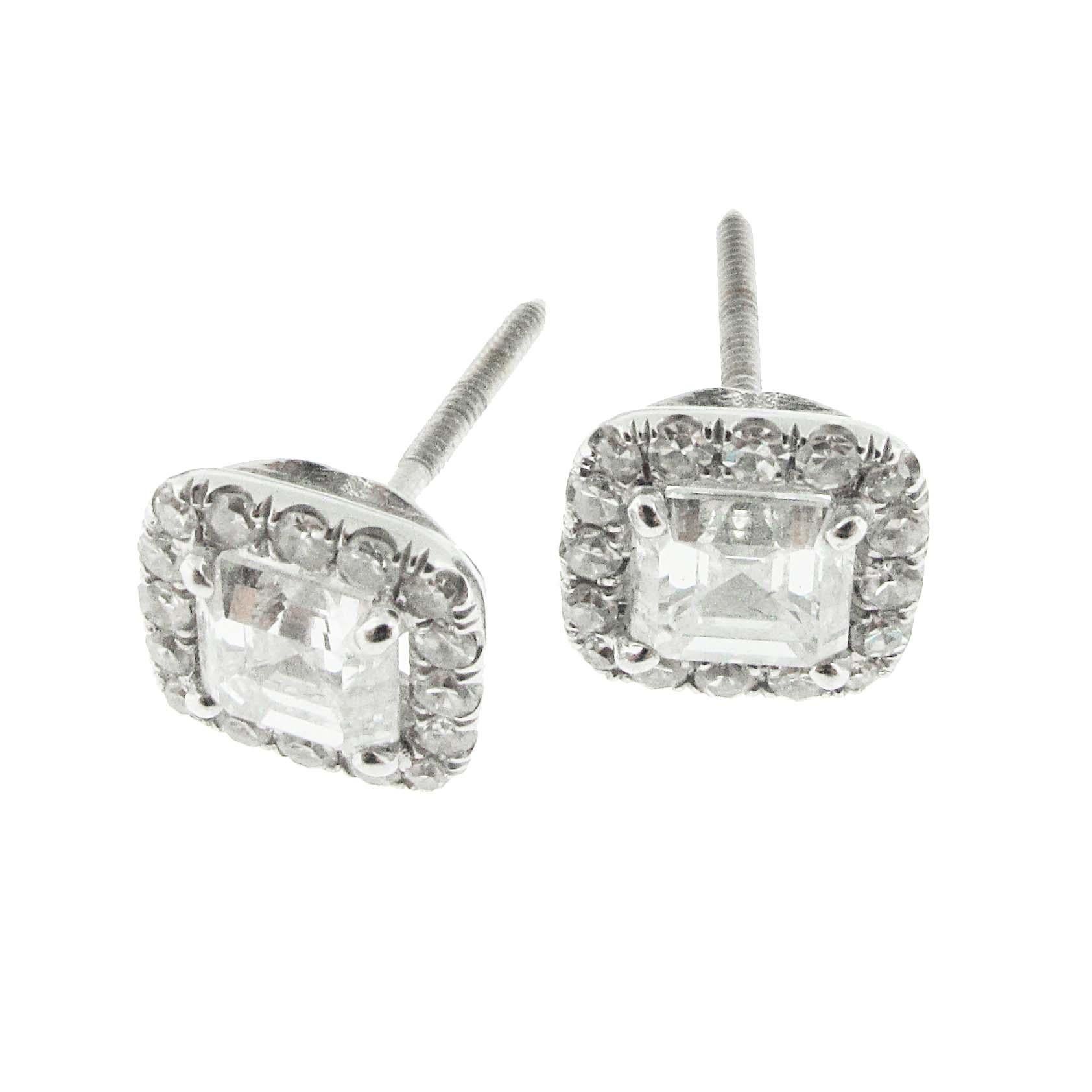 Great pair of matching GIA certified Square Emerald Cut diamond earrings. This pair of earrings has 2 GIA certified square emerald cut diamonds in the center, surrounded by pave diamonds. The center diamonds are certified .90 G-Si2 and .90 G-Si2. A