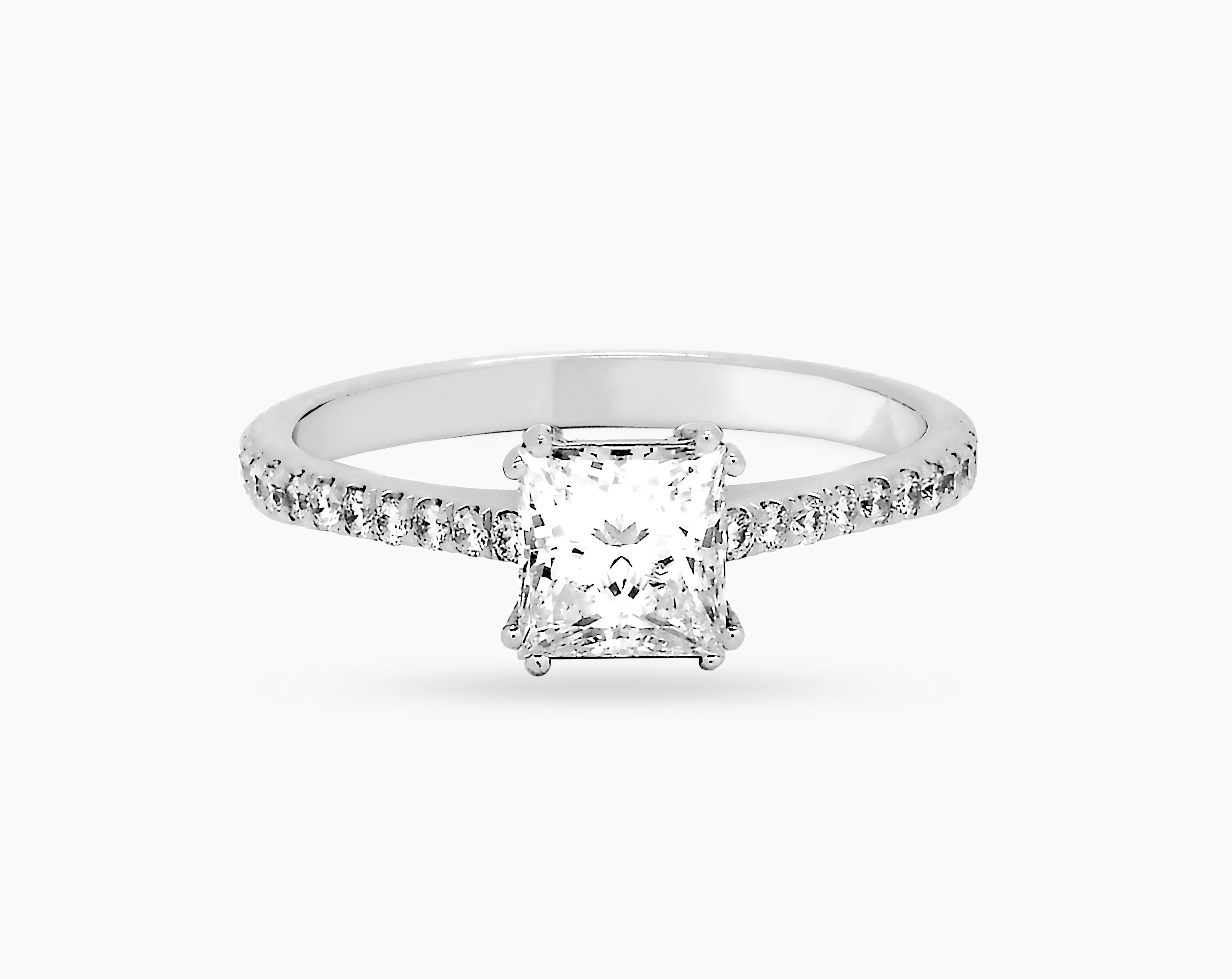 18-karat white gold engagement ring with a GIA certified princess cut diamond of 0.90 carat in G/SI1 quality and 22 brilliant cut fine diamonds (0.19ct) in F/G VS-SI quality. The ring is size 54, but is resizable. 