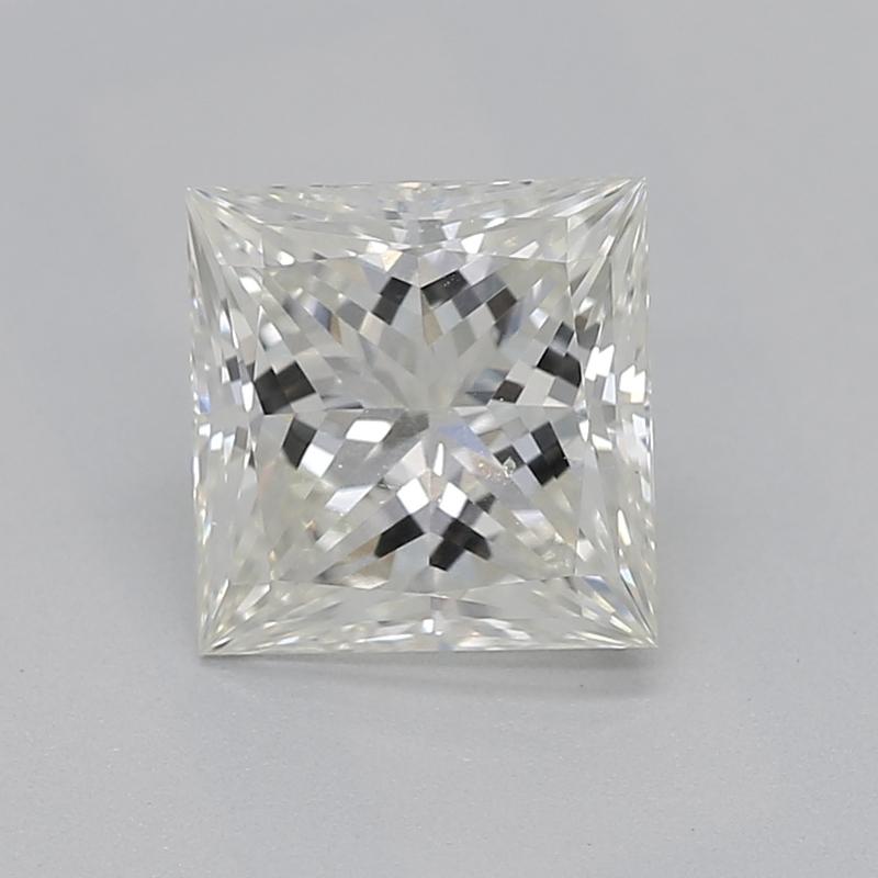 Handcrafted in New York, a captivating diamond ring that combines timeless elegance with contemporary design, featuring a stunning GIA-certified center stone of princess J SI1 weighing 0.90. This piece is distinguished by its unique arrangement,