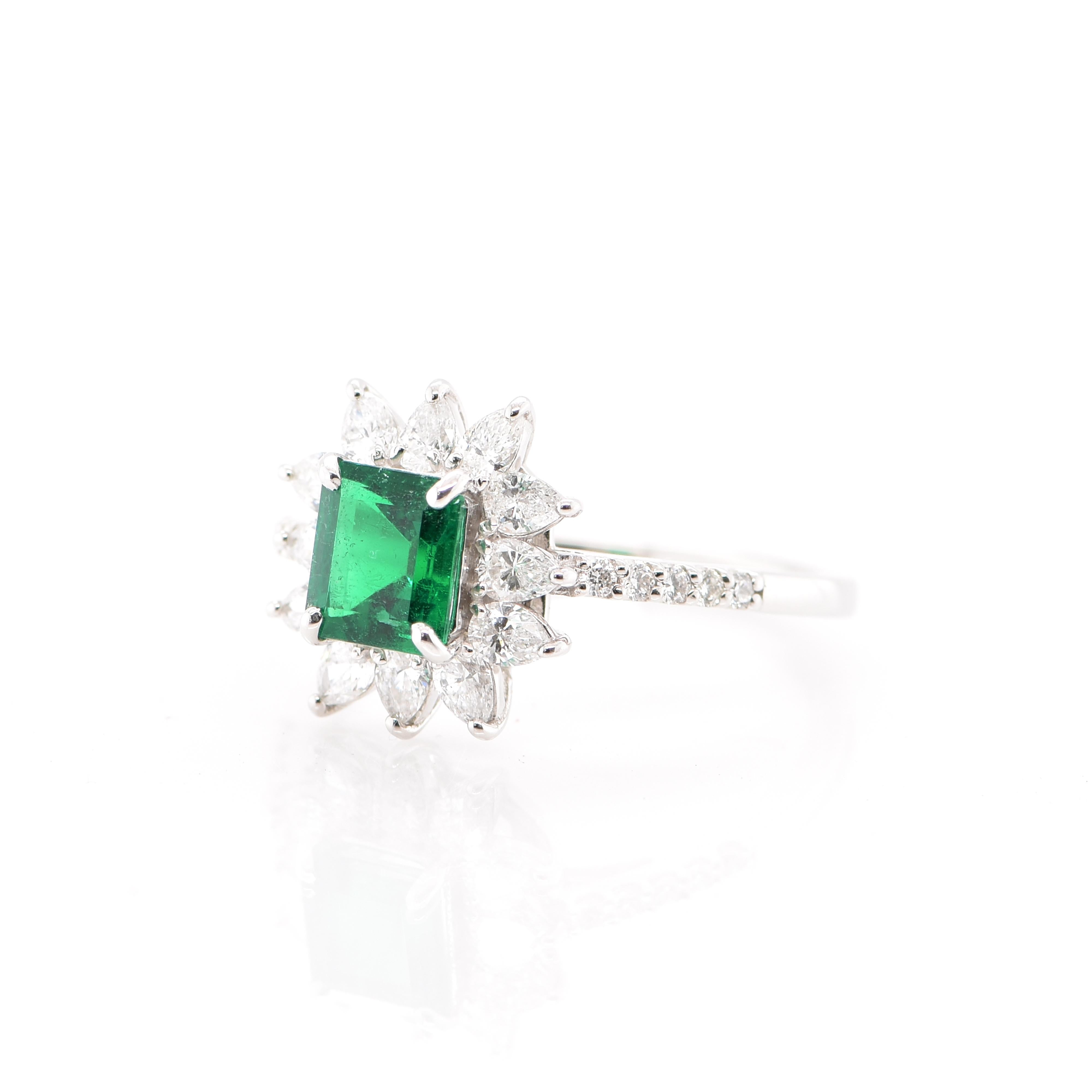 A stunning Halo Engagement Ring featuring a GIA Certified 0.91 Carat No Oil Colombian Emerald and 0.80 Carats of Diamond Accents set in Platinum. This is an extremely rare Emerald as it is not treated, whereas 95% of Emeralds in jewelry are clarity