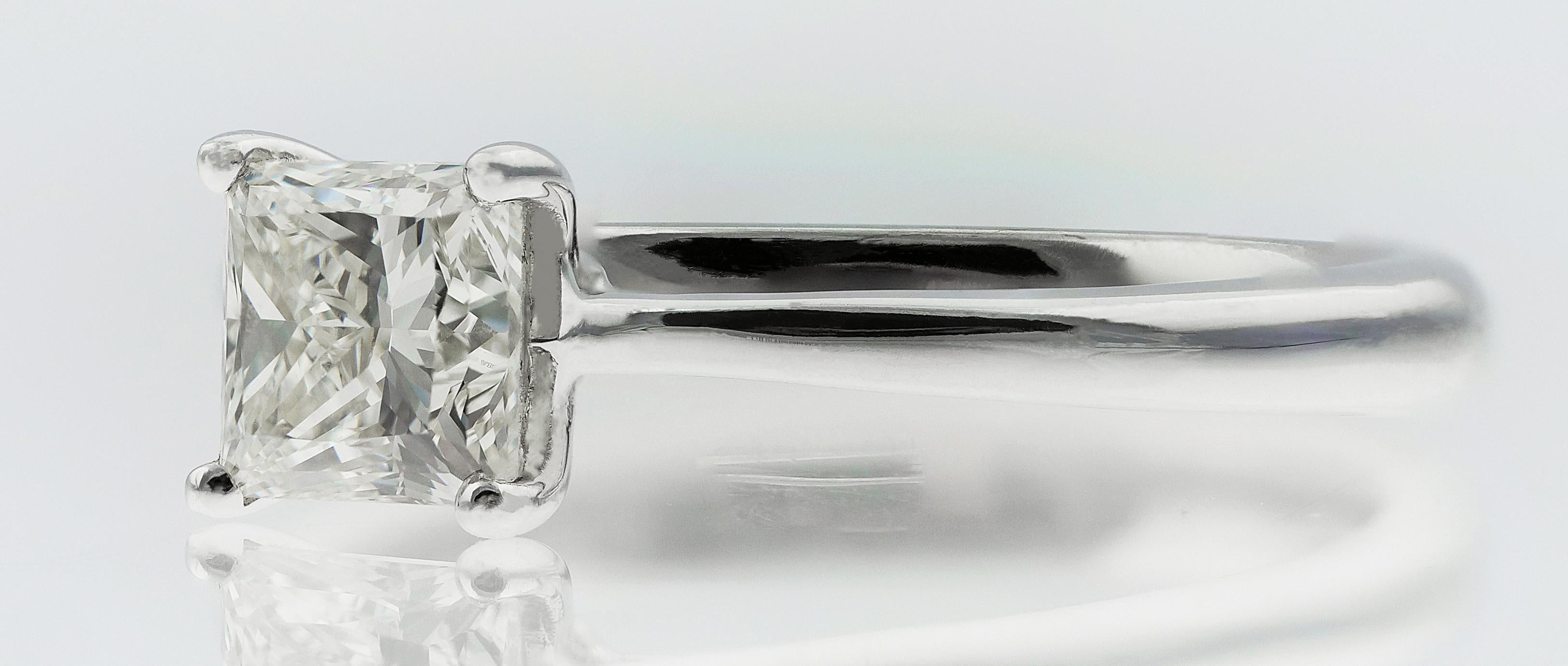 Single stone diamond ring. A  square modified brilliant (princess) cut white diamond set in a classic 4 claw hold upon an effortlessly elegant 18 ct white gold band. 
1 X Diamond, GIA report no: 15507634,  Princess/ Square Modified Brilliant Cut,