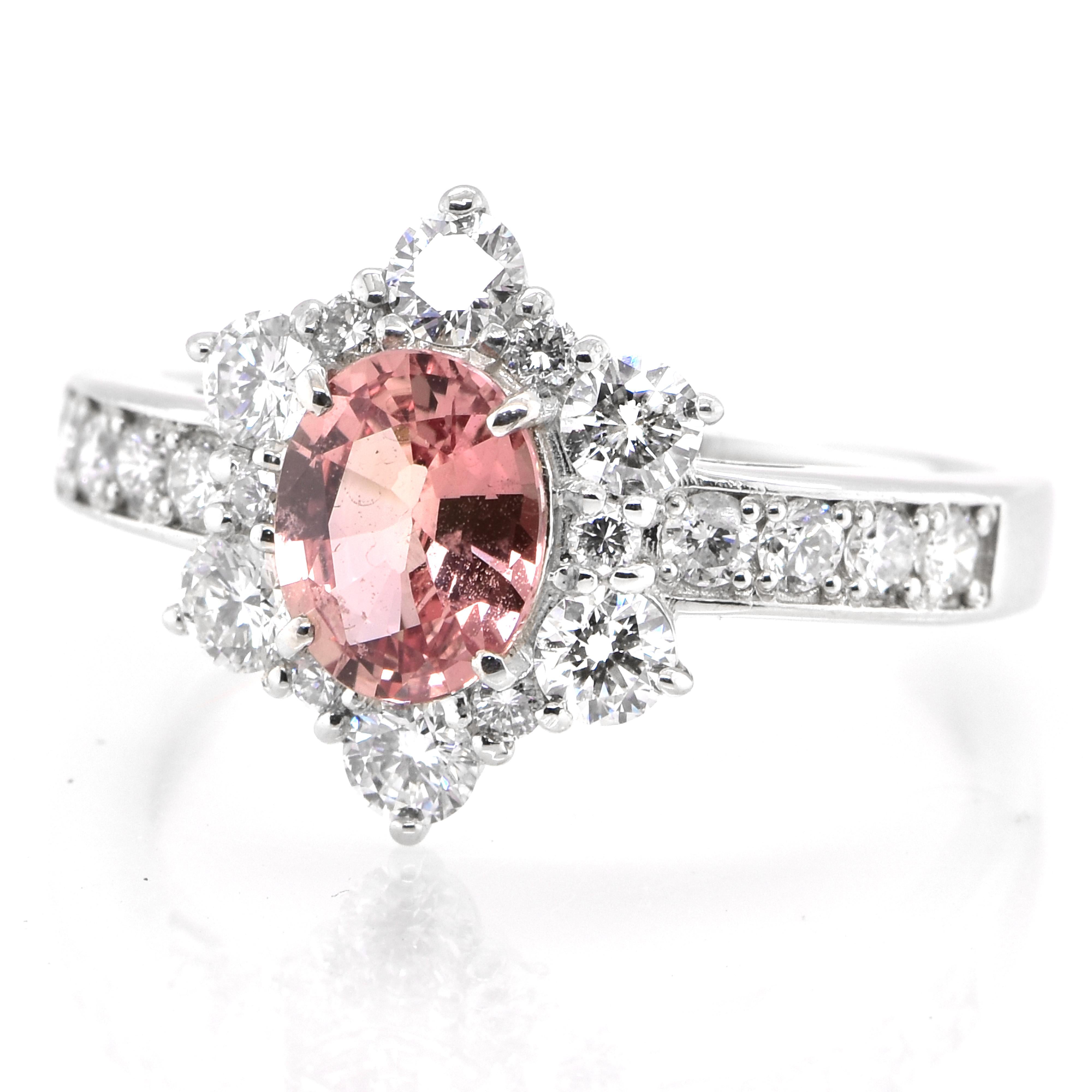 A beautiful ring featuring GIA Certified 0.99 Carat Natural Padparadscha Sapphire and 0.76 Carats of Diamond Accents set in Platinum. Sapphires have extraordinary durability - they excel in hardness as well as toughness and durability making them