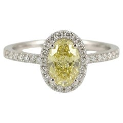 GIA Certified 1 Carat Fancy Intense Yellow Oval Diamond Halo Engagement Ring