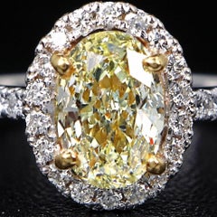 GIA Certified 1 Carat Fancy Light Yellow Oval Diamond Halo Engagement Ring