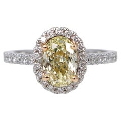 GIA Certified 1 Carat Fancy Light Yellow Oval Diamond Halo Engagement Ring