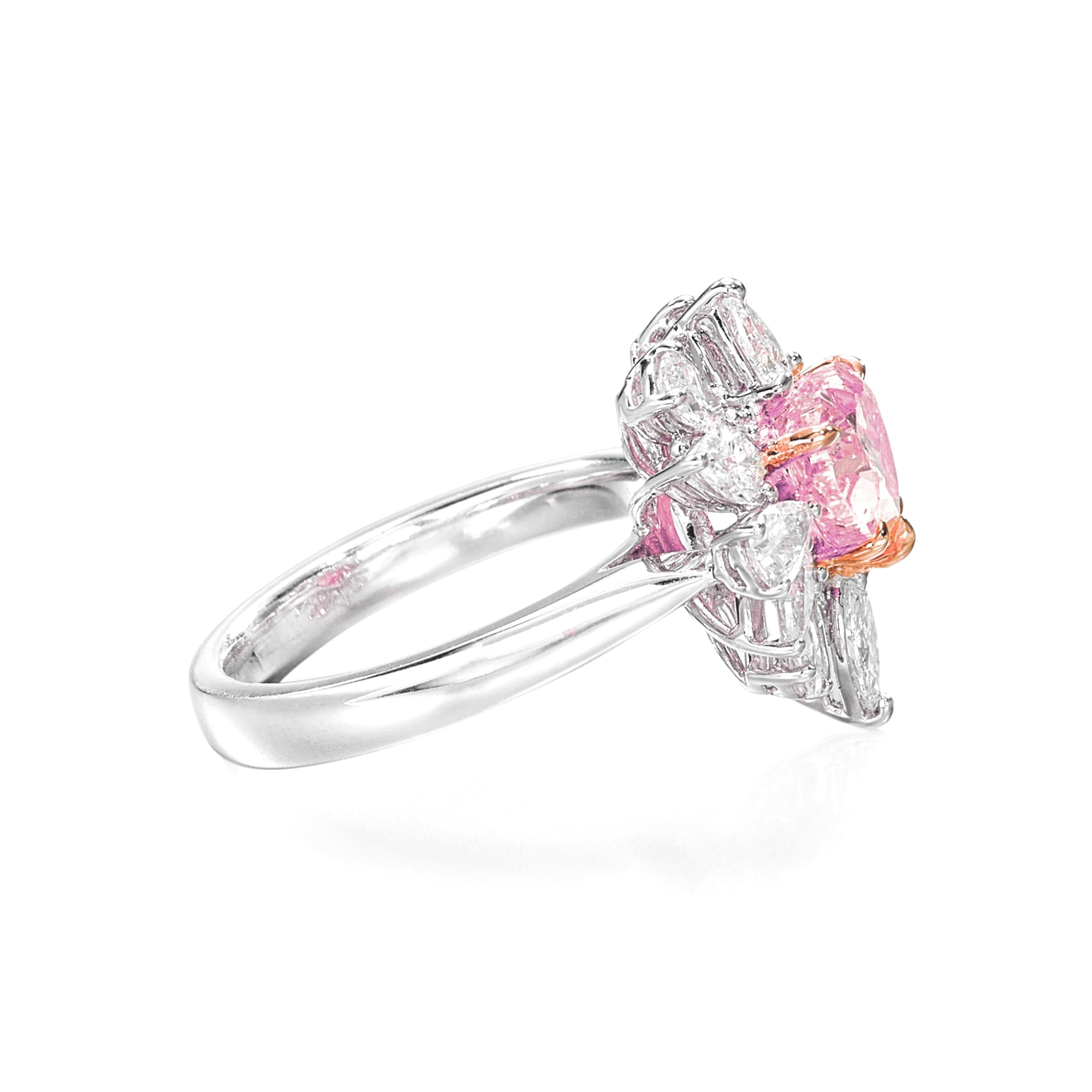 A Romantic Statement Ring by Cecile Blake
Experience the ultimate expression of love and luxury with this exquisite heart-shaped fancy pink diamond ring. The center stone, weighing approximately 1 carats (GIA-certified at 1 carats), showcases a