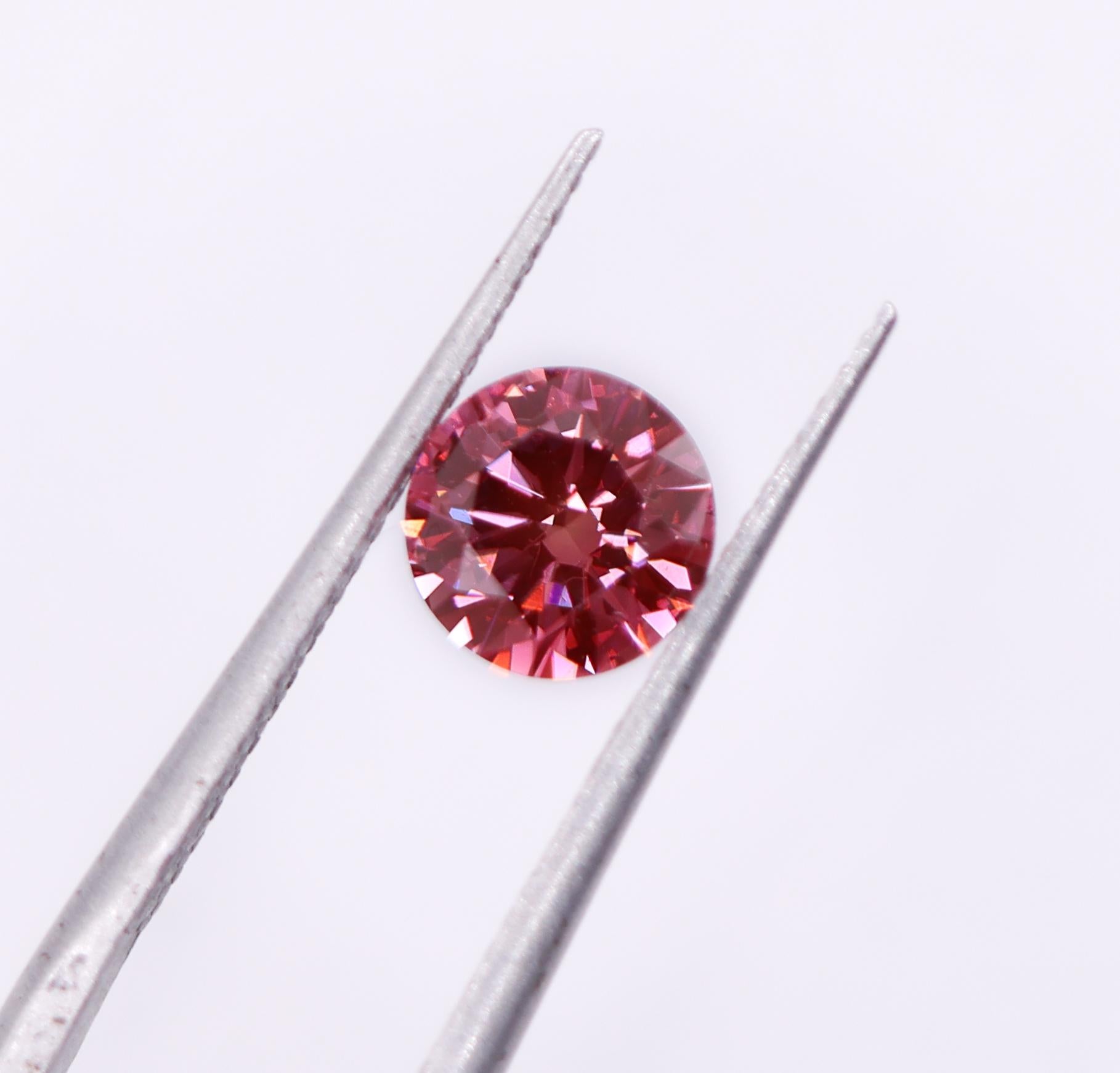 We are thrilled to bring you this absolutely gorgeous pink natural earth mined diamond! This diamond is HPHT treated, giving it a stunning fancy vivid purplish pink color. A fabulous size for an engagement ring or statement piece that is sure to
