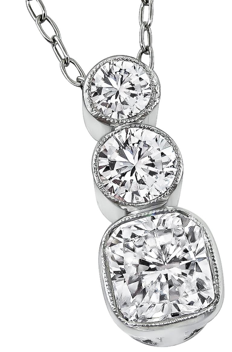 This amazing platinum pendant necklace is set with a sparkling GIA certified radiant cut diamond that weighs 1.00ct. graded E color with VS2 clarity. The diamond is accentuated by dazzling round cut diamonds that weigh approximately 0.50ct. graded
