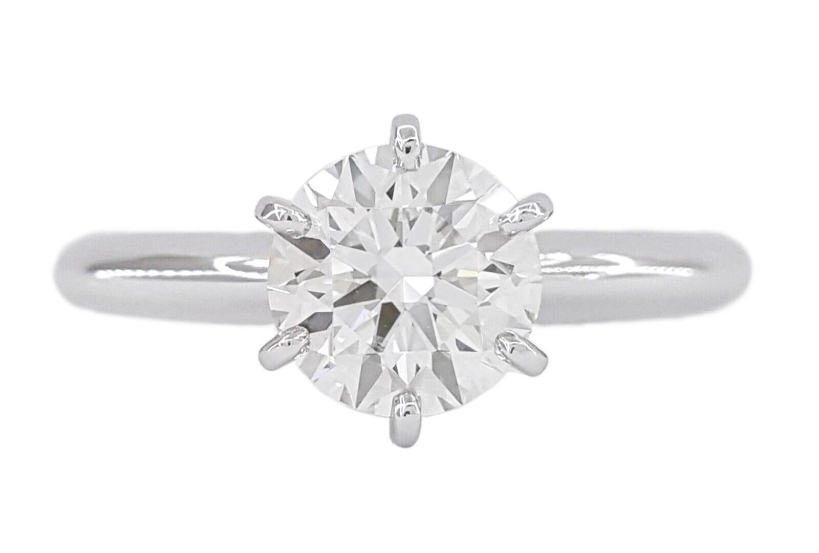 This exquisite jewelry piece showcases a meticulously selected and certified by the GIA 1,00 Ct round Brilliant Cut diamond exuding unparalleled brilliance and allure. Nestled within an elegant 18k white gold solitaire setting, this diamond is a
