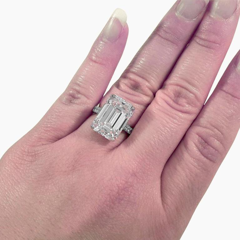 10 Carat emerald Cut Diamond engagement ring is an exquisite piece crafted in platinum. The centerpiece is a stunning 10 ct natural emerald cut diamond that boasts an G color grade and VS1 clarity, indicating exceptional quality.

