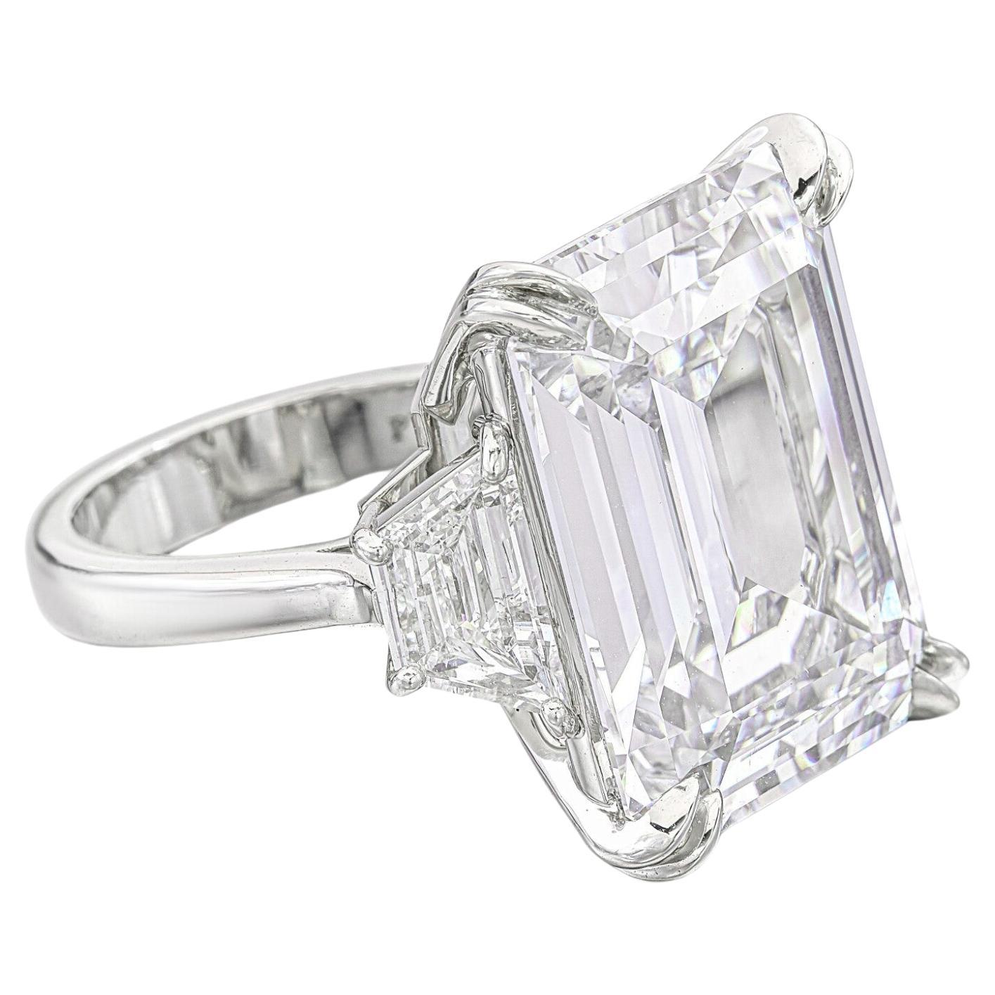 This magnificent ring features a GIA-certified 10.40 carat emerald-cut diamond, elegantly set in 18K white gold. The diamond boasts a G color grade, offering a bright, near-colorless appearance, while its VVS2 clarity grade highlights its