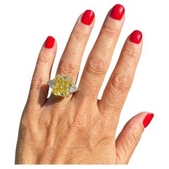 GIA Certified 10 Carat Fancy Yellow Diamond Ring with Trillion Side Stones