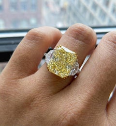 GIA Certified 10 Carat Fancy Yellow Radiant Cut Diamond Three-Stone Ring VS2