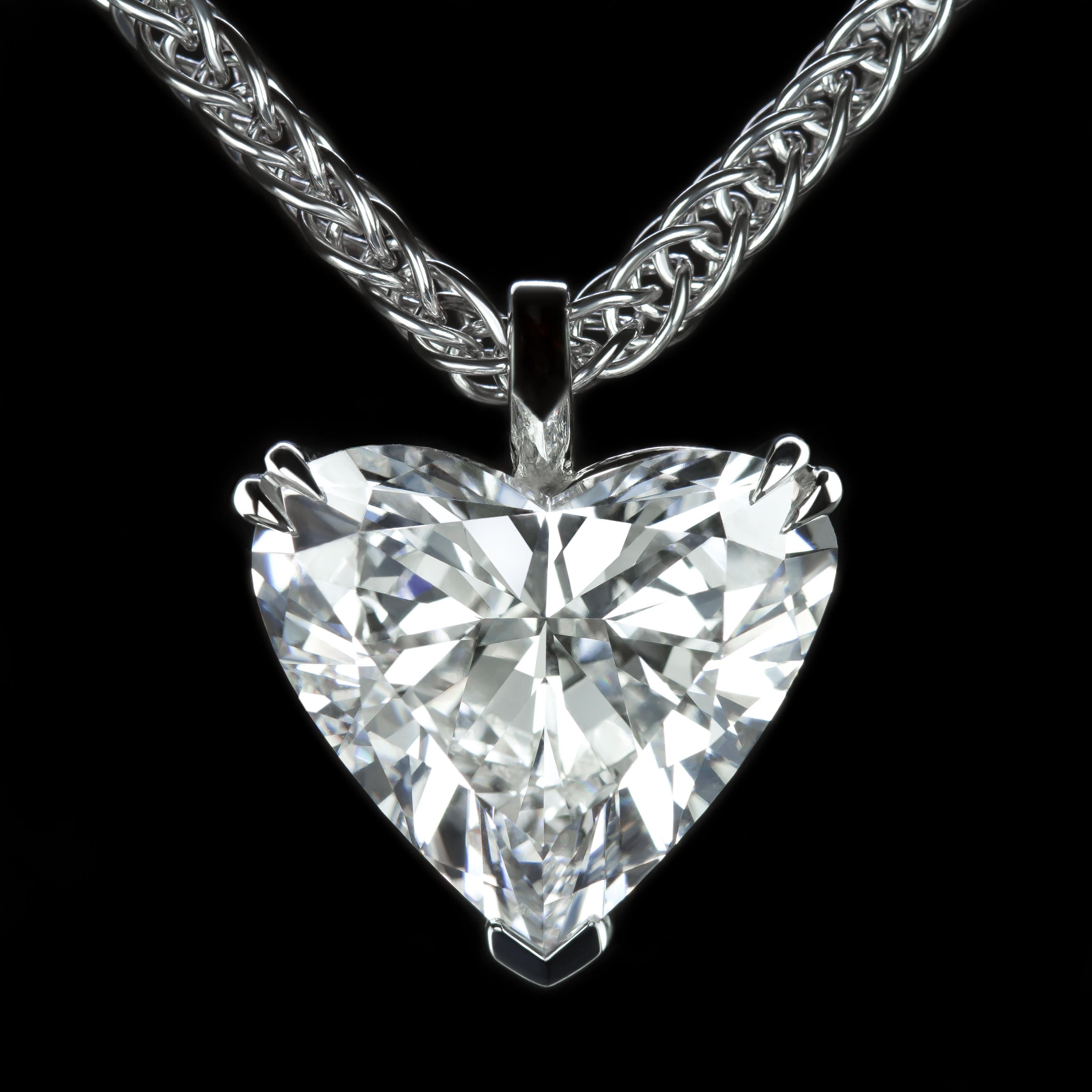 This amazing heart diamond necklace features a large heart shaped diamond weighs 10 carat. 

The diamond is bright white, completely clean, and vibrant with bold sparkle! The 18k White gold setting is classic with a sleek, minimalist design. 