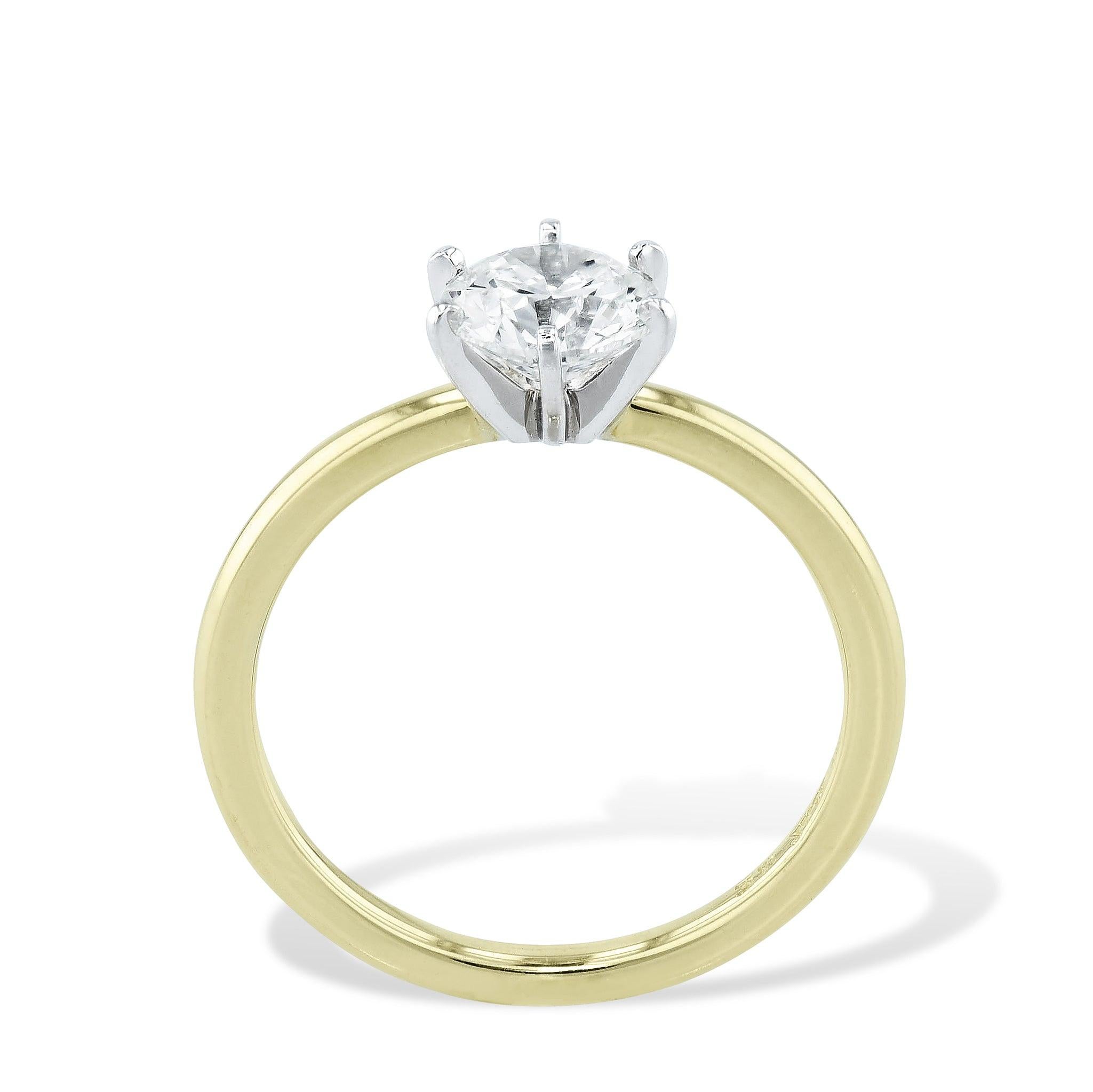 
Captivate your senses with a Round Diamond Engagement Ring. 
The 6 Prong Platinum Head  around the center stone and a Yellow Gold Band is sure to captivate. 
This magnificent piece from our Estate & Vintage Collection is sized at 7.

Round Diamond