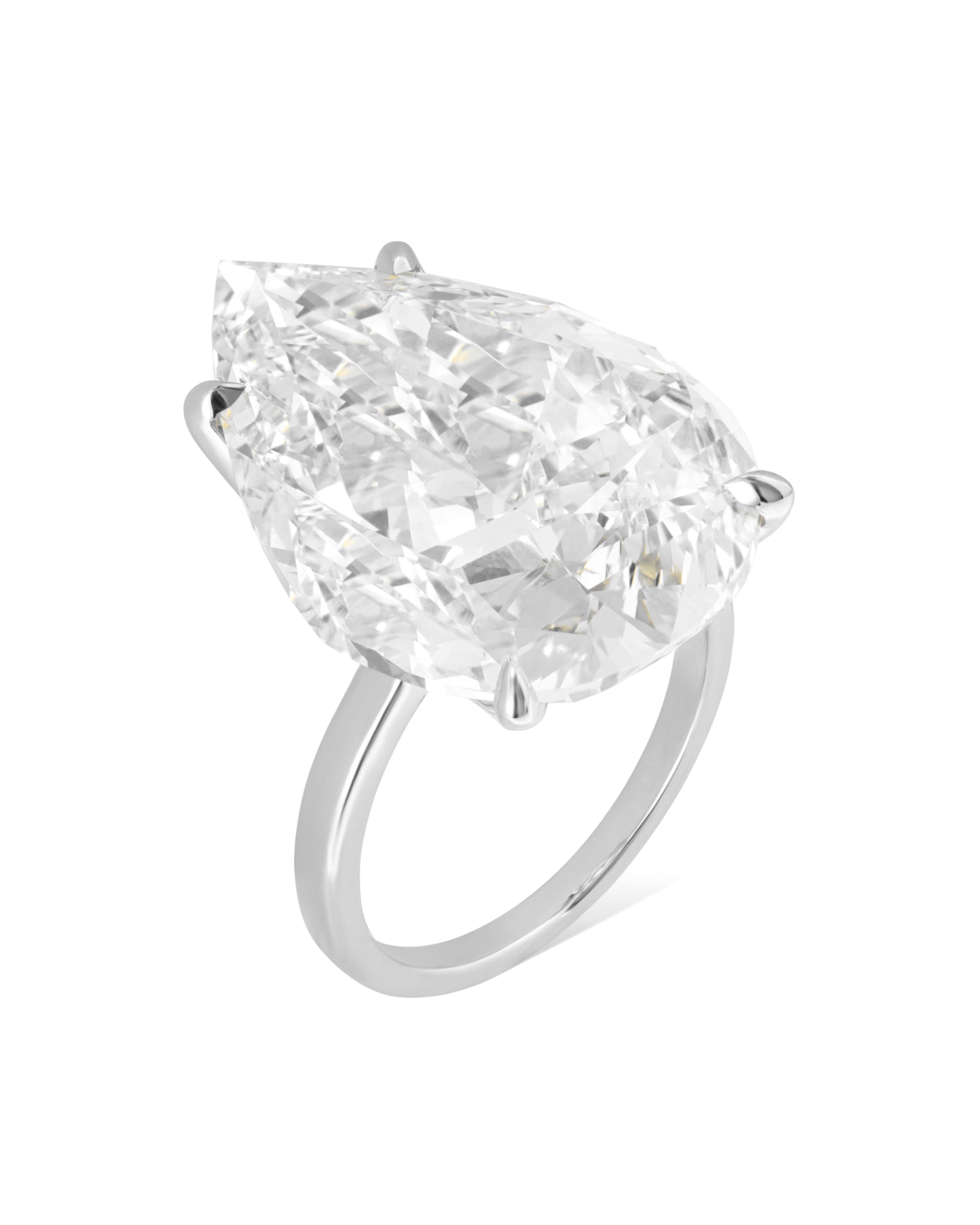 This exquisite ring by Cecile Blake is crafted in platinum and features a breathtaking 10 carat pear cut diamond, certified by GIA. The vibrant center stone is accented by two tapered baguette diamonds, adding a sophisticated touch to this elegant