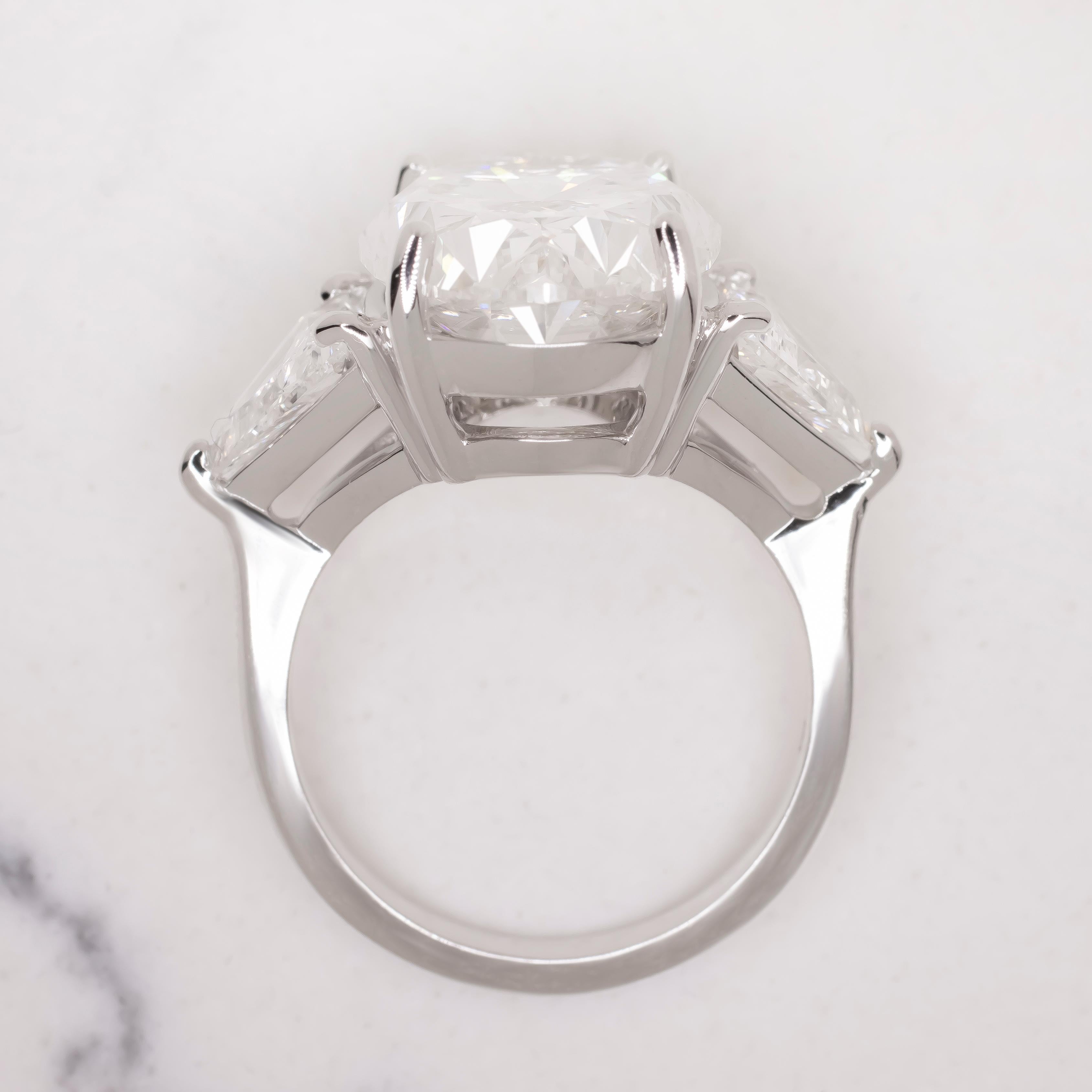 Contemporary GIA Certified 10.01 Oval Diamond Ring with Trillion Diamond in Platinum For Sale
