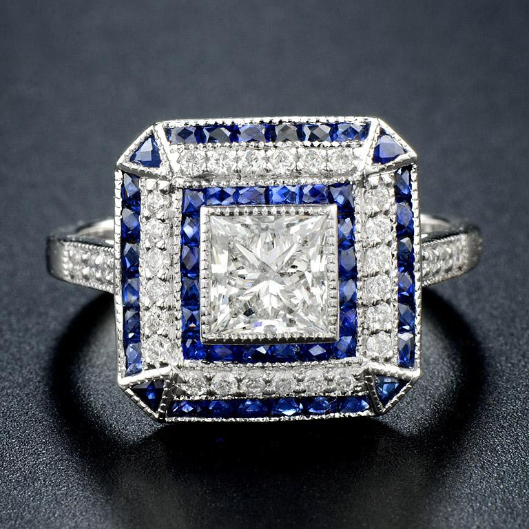 GIA Certified 1.00 Carat F Color VS1 Clarity Diamond in the center.

The ring was decorated with art deco style French Cut Blue Sapphire total 0.98 carat and another diamonds 0.23 carat.

The ring was made in 18K White Gold size US.7

D/F-VS1 (1-1