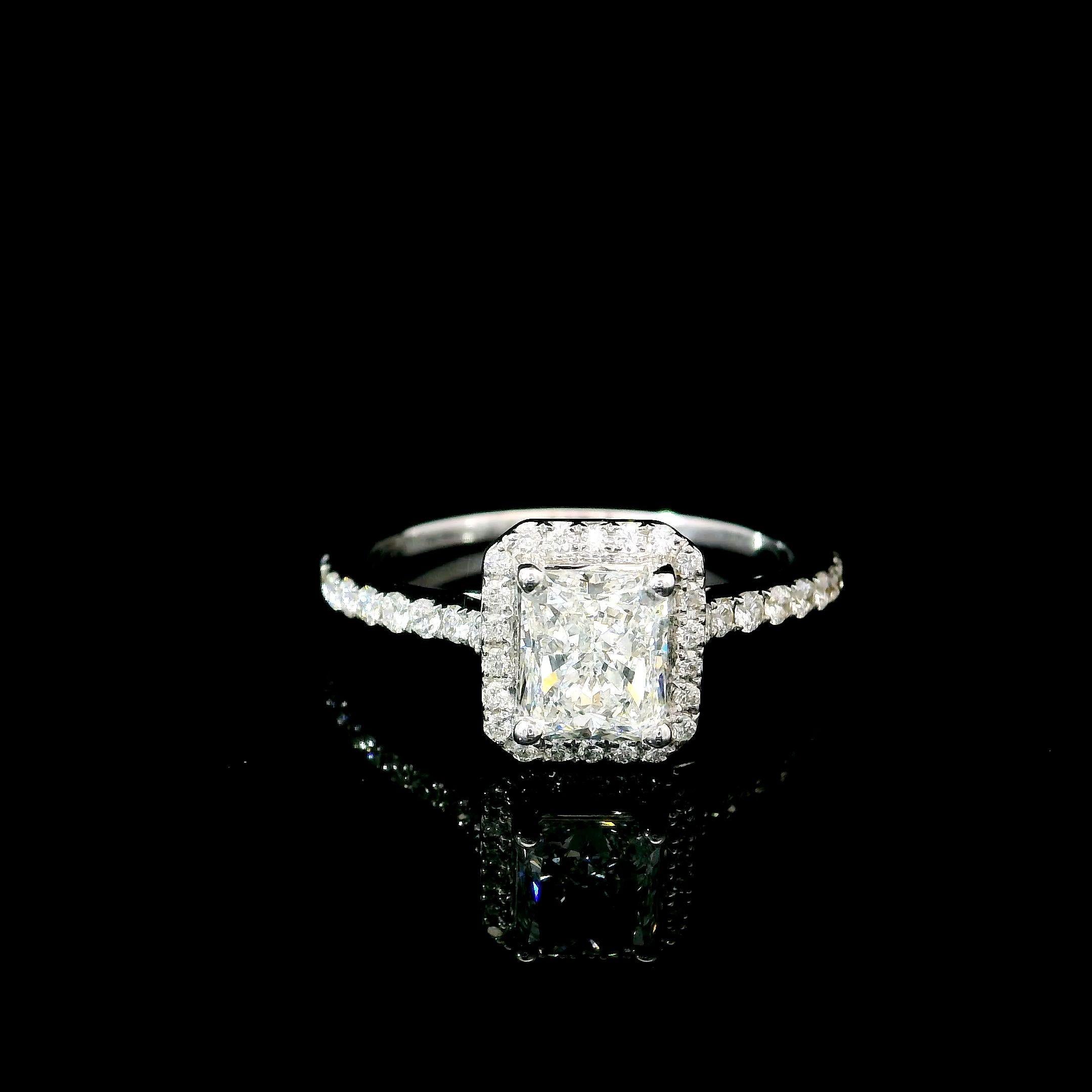 18kt white gold ring with diamonds
  
  Gold colour & karat: White gold 18kt
  Weight: 2.74 grams
  
  Set with-
  Stone type: Diamonds
  Shape: Radiant
  Carat: 1.00
  Colour: E Colour
  Clarity: VVS1
  
  Surrounding Stones: Diamonds
 1) White