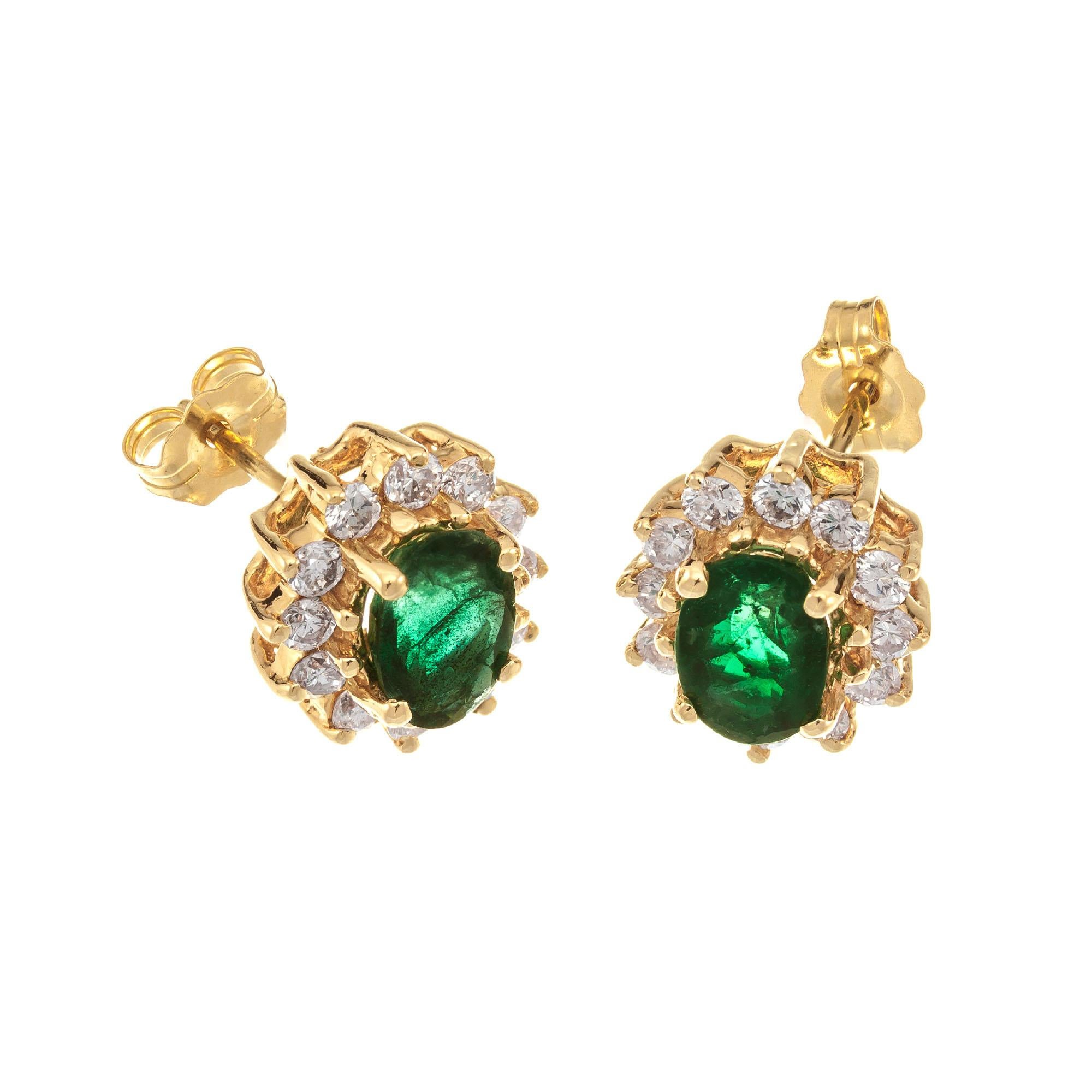 Green GIA certified Emerald and Diamond stud earrings. GIA certified oval emeralds with a halo of round diamonds set in 14k yellow gold baskets. 
 
2 oval green emeralds, approx. 1.00ct GIA Certificate # 2205530037
24 round brilliant cut diamonds