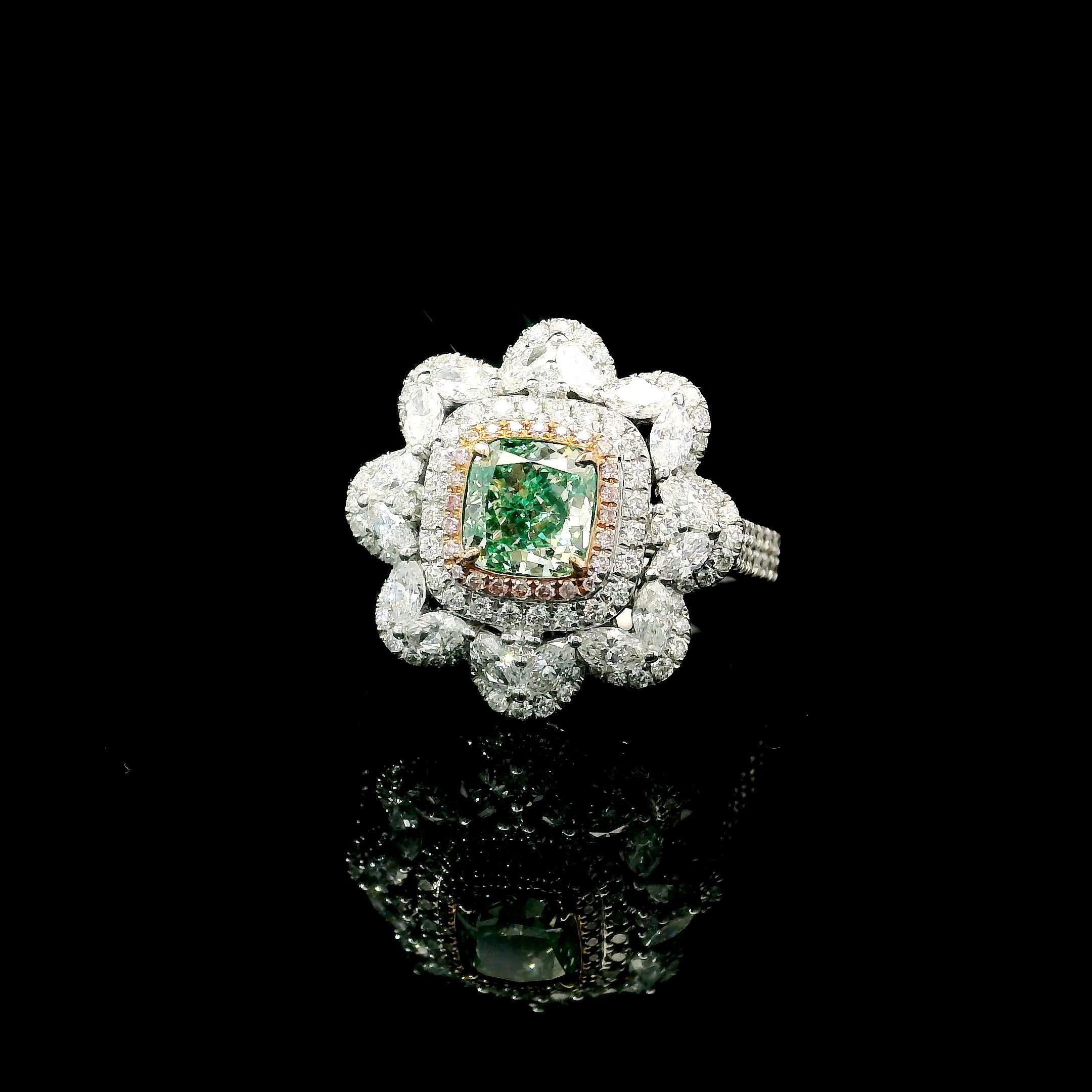 18kt white gold ring with diamonds
  
  Gold colour & karat: White gold 18kt
  Weight: 5.6 grams
  
  Set with-
  Stone type: Diamonds
  Shape: Cushion
  Carat: 1.00
  Colour: Fancy Grayish Yellowish Green  
  Clarity: SI1
  
  Surrounding Stones: