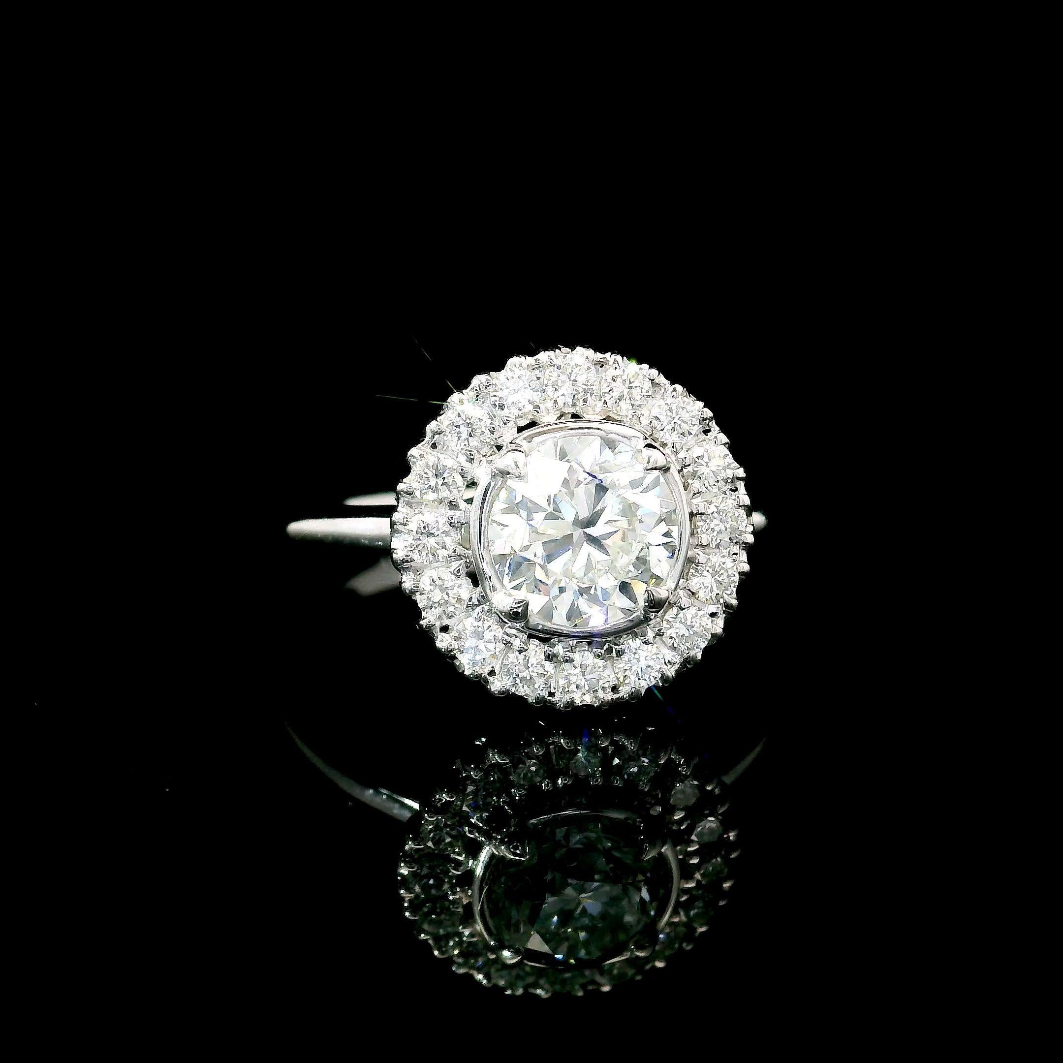 18kt white gold ring with diamonds
  
  Gold colour & karat: White gold 18kt
  Weight: 3.85 grams
  
  Set with-
  Stone type: Diamonds
  Shape: Round
  Carat: 1.00 ct
  Colour: H Colour
  Clarity: VS2
  
  Surrounding Stones: Diamonds
 1) White