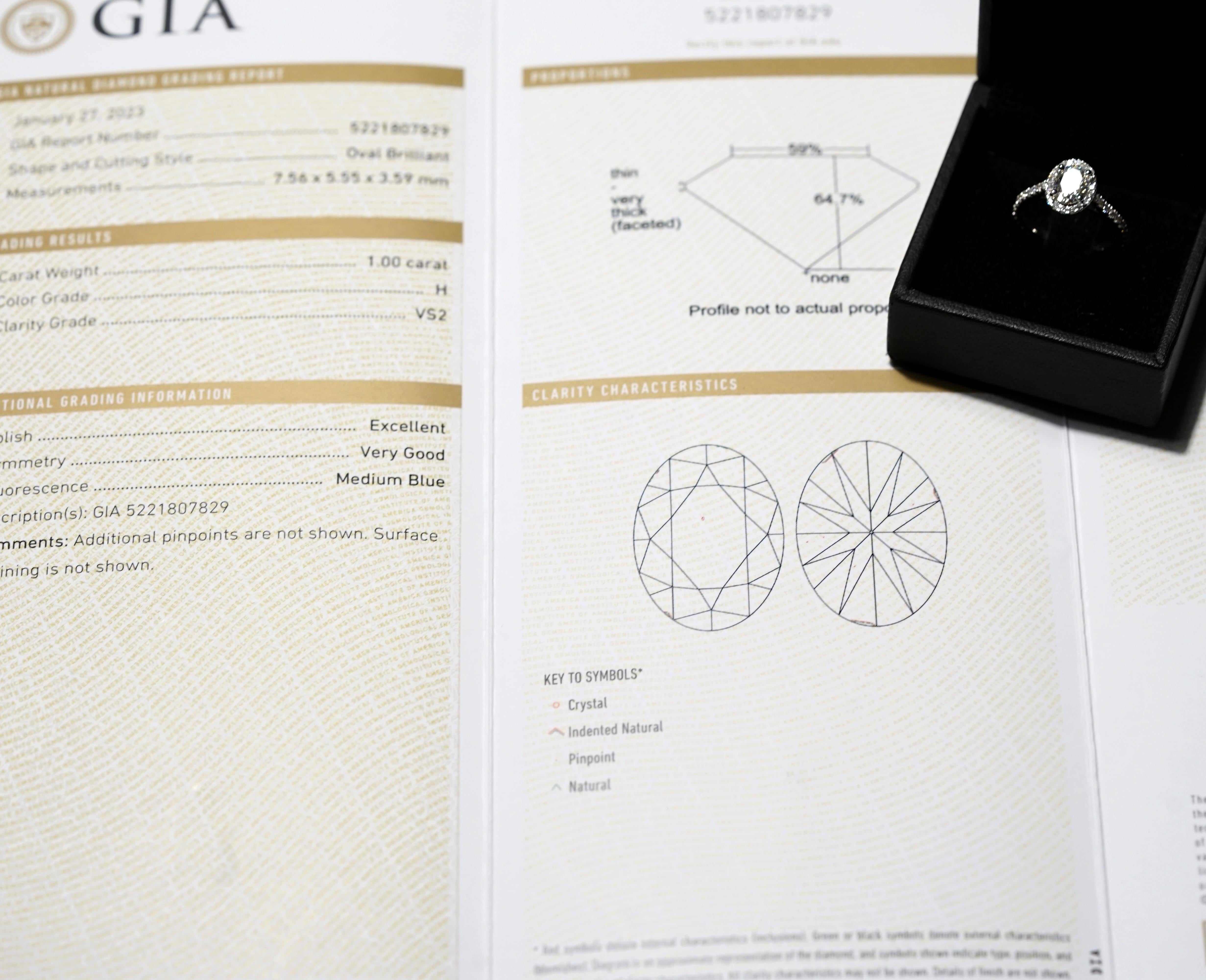 GIA Certified 1.00 Carat H VS2 Oval Diamond Halo Platinum Ring In New Condition For Sale In Chicago, IL