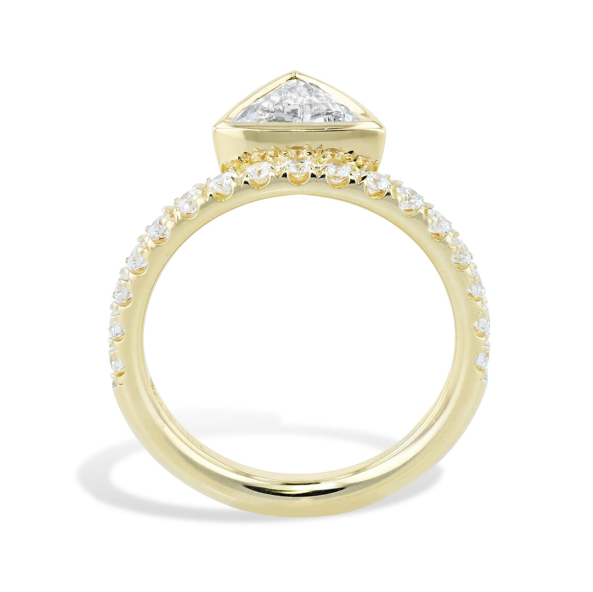 This is an exquisite 18kt Yellow gold Trillion Bezel Set Diamond with Diamond Band.  
It will captivate you with its bright-white sparkle. 
It has a one carat Center Diamond that is H in color and VS1 in clarity. 
The diamond is trillion cut and is